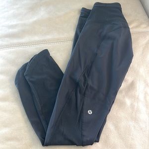 Lulu 3/4 pants with mesh on part of the legs.